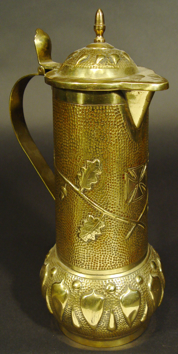 Appraisal: Continental brass flagon of military interest with hinged lid embossed