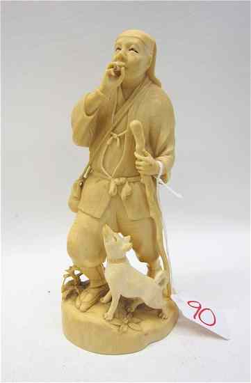 Appraisal: JAPANESE IVORY CARVED FIGURE man standing clutching a staff bag