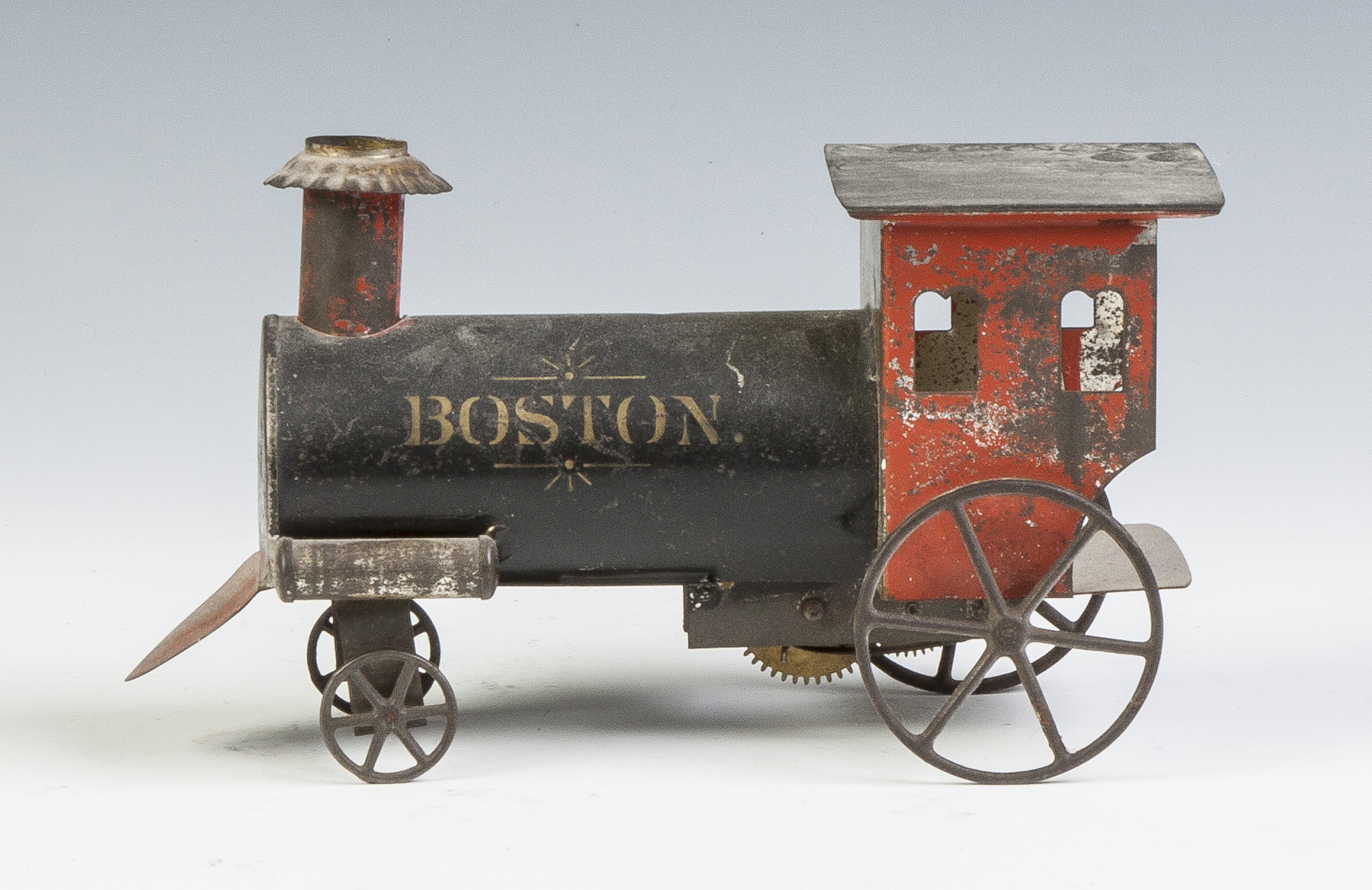 Appraisal: Boston Painted Tin Clock Work Locomotive th cent American