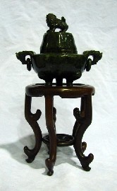 Appraisal: A Chinese footed koro cover in moss green jadite together