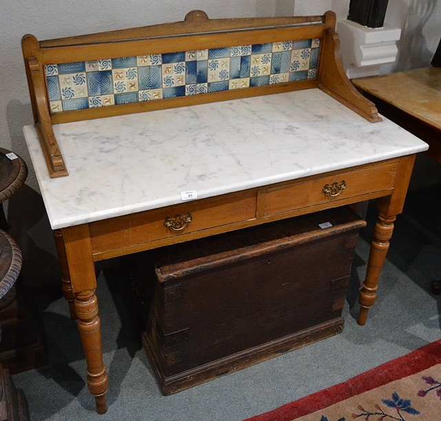 Appraisal: A Victorian ash wash standwith marble and tiled back cm