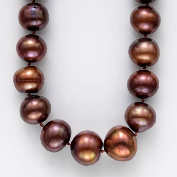 Appraisal: A bronze semi-baroque South Sea cultured pearl and fourteen karat