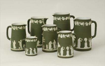 Appraisal: Seven Wedgwood Green Jasperware Pitchers Marked to in