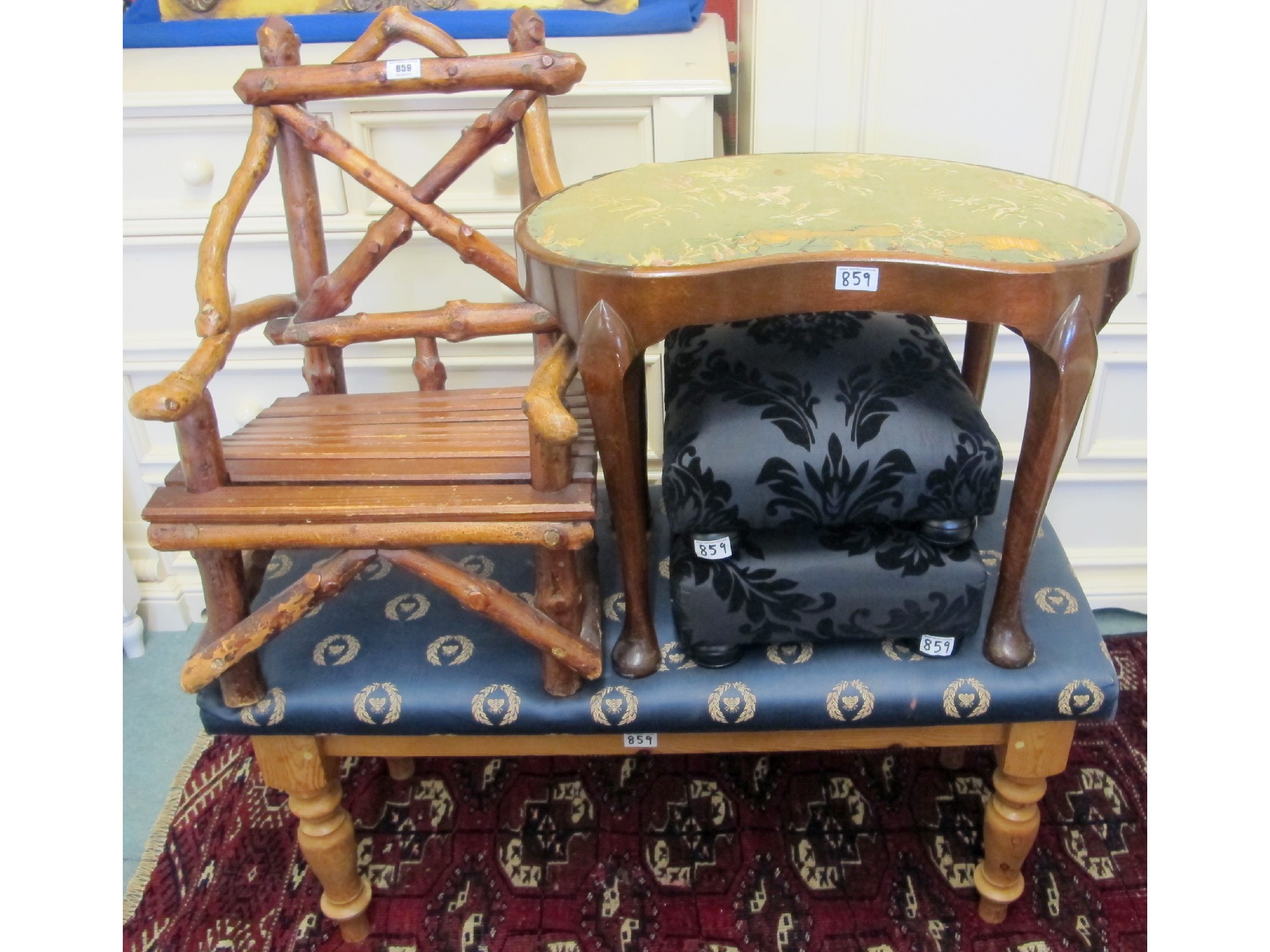 Appraisal: A blue upholstered pine stool a rustic wooden child's chair