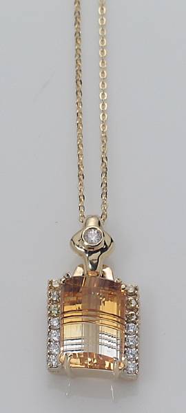 Appraisal: A citrine yellow diamond diamond and k gold pendant centering