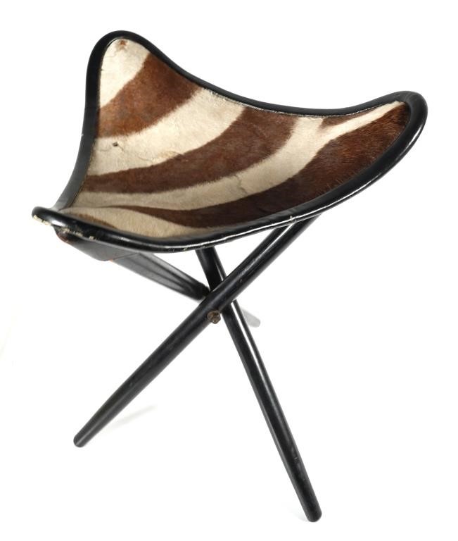 Appraisal: Old three-cornered folding chair with zebra skin top Some repaired