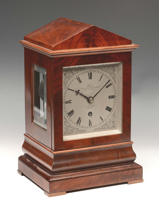 Appraisal: A VICTORIAN MAHOGANY LIBRARY TIMEPIECE with silvered Roman dial with