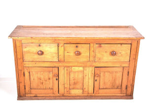 Appraisal: A Victorian pine dresser base with three frieze drawers above