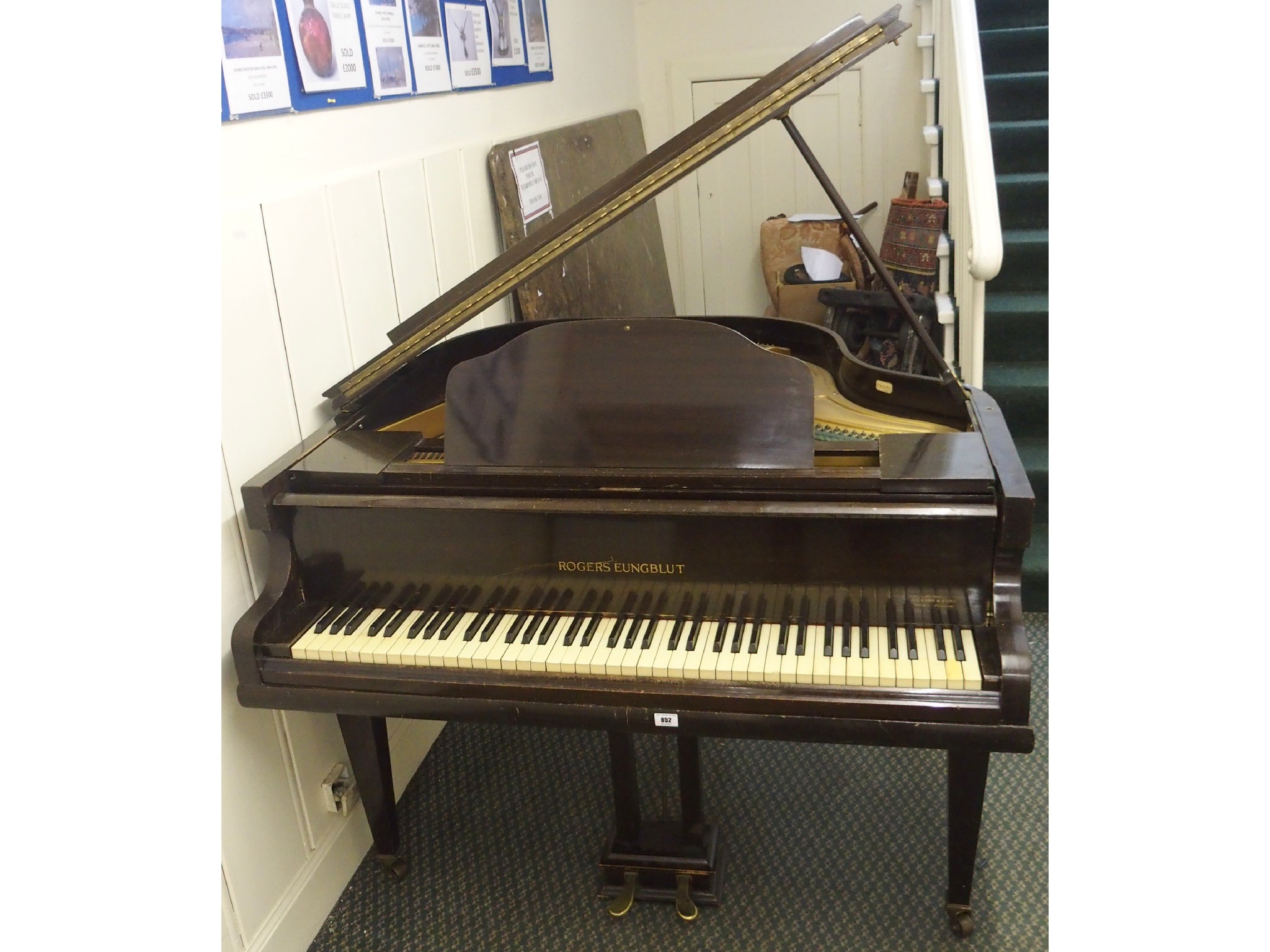 Appraisal: A baby grand piano by Rogers Eungblut retailed by J