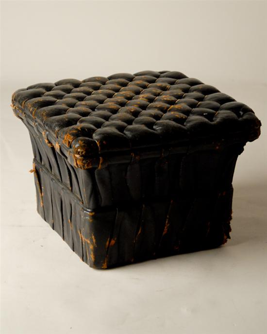 Appraisal: A Victorian Footstool black leather overall tufted seat canted pleated