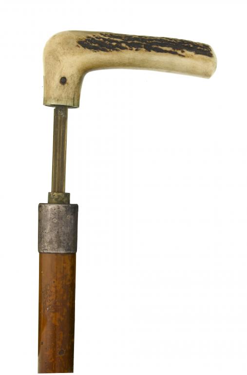 Appraisal: A VICTORIAN STAGHORN HANDLED GADGET CANE the malacca shaft containing