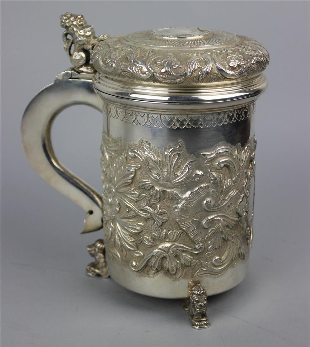 Appraisal: GERMAN BAROQUE STYLE SILVER TANKARD modern with crowned lion's feet