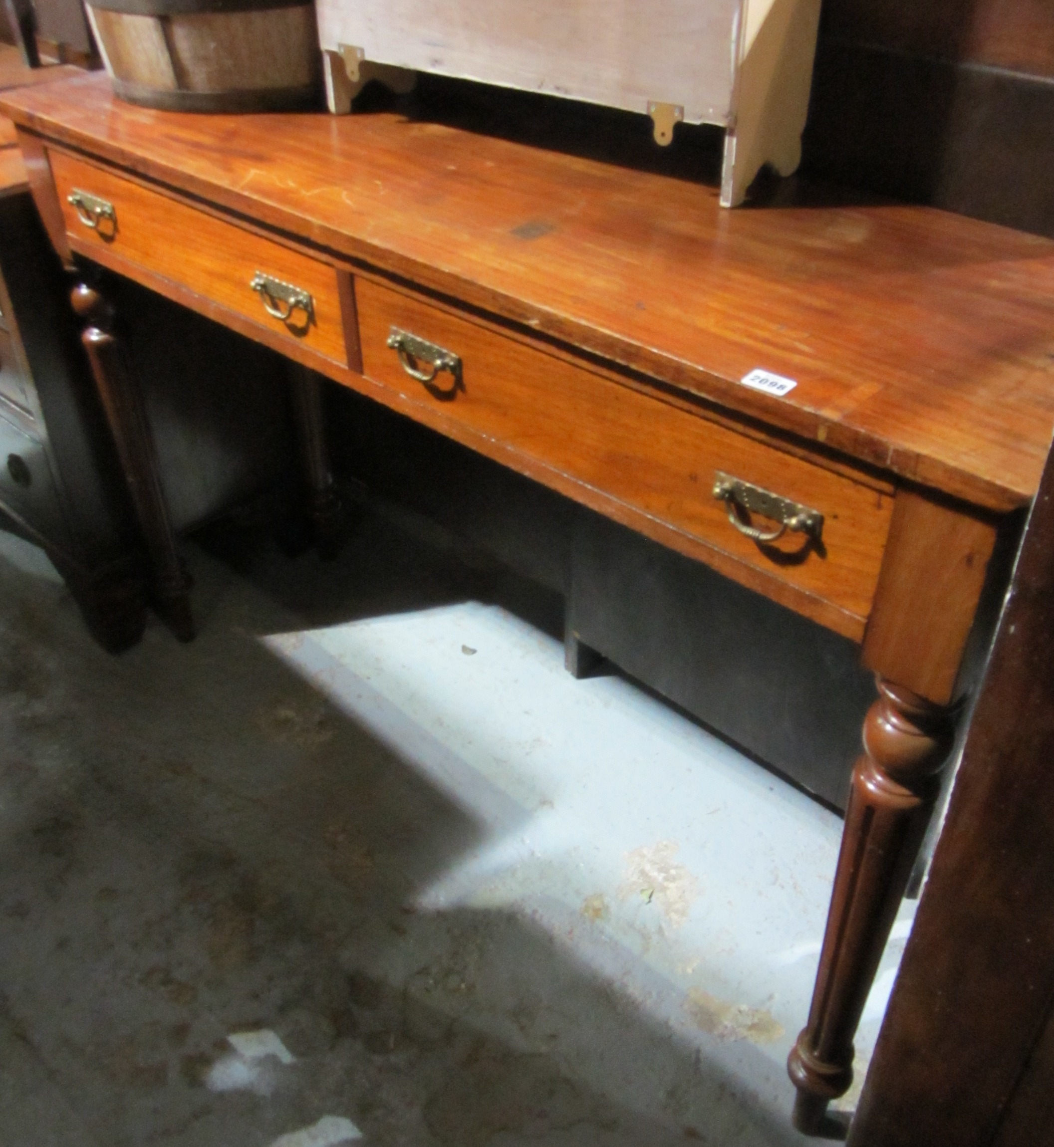 Appraisal: A Victorian mahogany two drawer side table on fluted supports