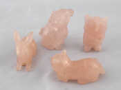 Appraisal: Four carved rose quartz figures being a cat a dog