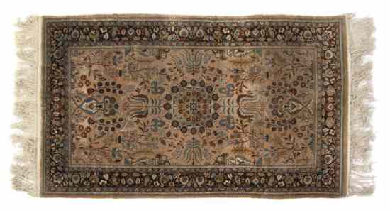 Appraisal: A Persian Silk Rug having a center medallion within triple