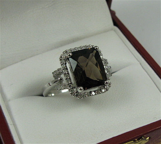 Appraisal: SMOKEY QUARTZ DIAMOND AND K WHITE GOLD RING centering a