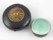 Appraisal: A sterling silver pill box with green enamelled engine turned