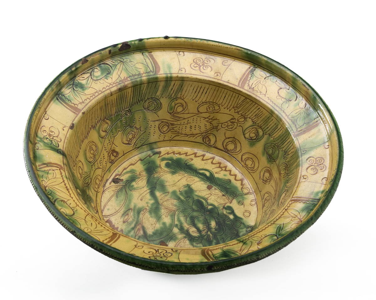 Appraisal: SGRAFFITO-DECORATED REDWARE BASIN DEPICTING FISH AND SEA CREATURES GLAZED IN