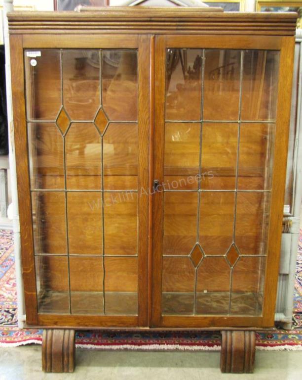 Appraisal: An early mid th century bookcase with with leaded glass