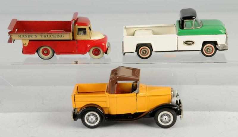 Appraisal: Lot of Tin Vehicle Friction Toys Description Japanese Working Includes