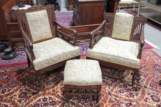 Appraisal: TWO ARMCHAIRS AND A FOOTSTOOL Walnut set with carved and