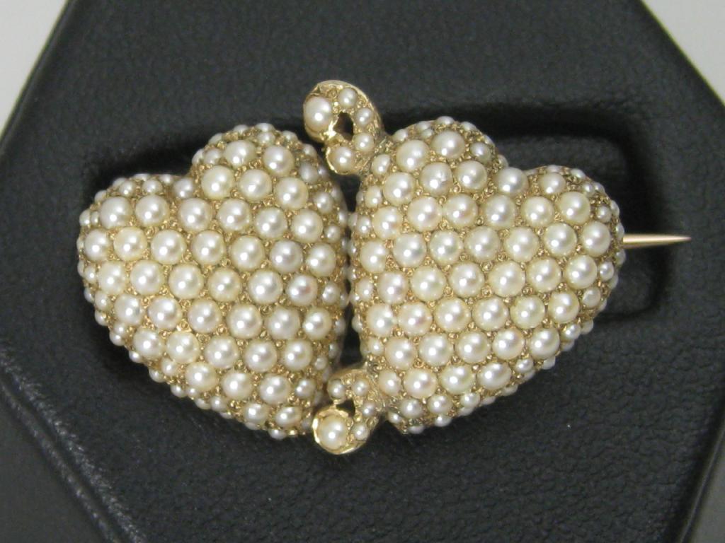 Appraisal: A Victorian double Heart Brooch set all over seed pearls