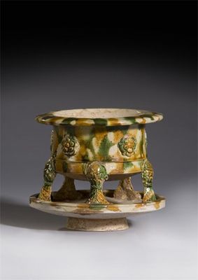 Appraisal: An unusual Chinese sancai-glazed pottery censer the cylindrical body applied