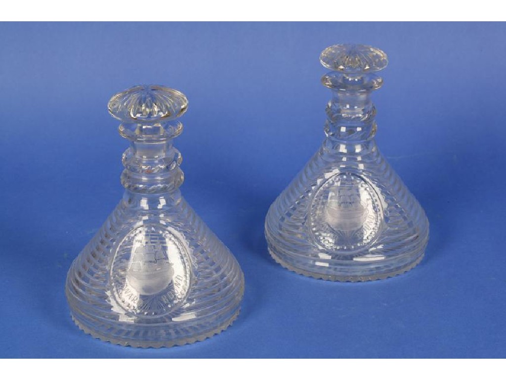 Appraisal: A PAIR OF CUT-GLASS SHIPS DECANTERS with ringed necks and