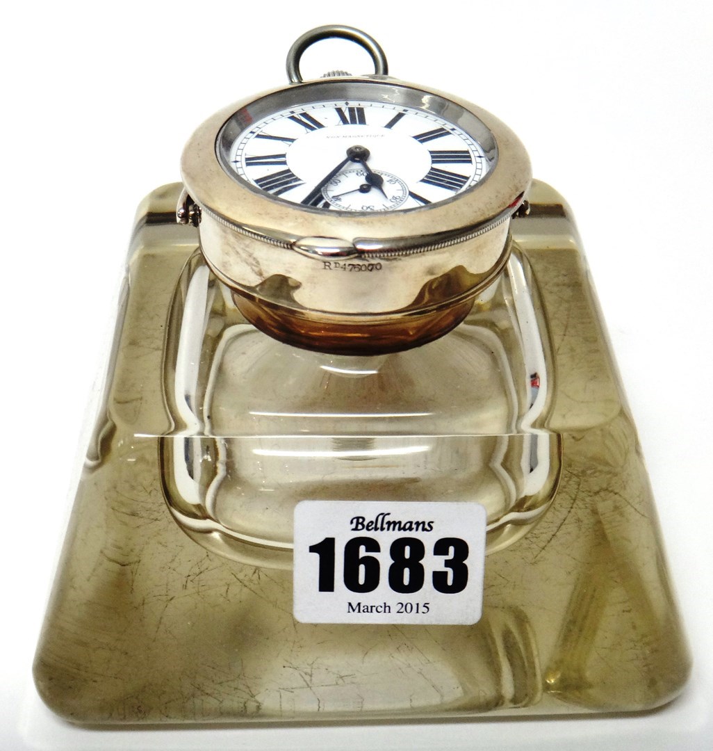 Appraisal: A silver mounted glass inkwell cum desk timepiece of tapered