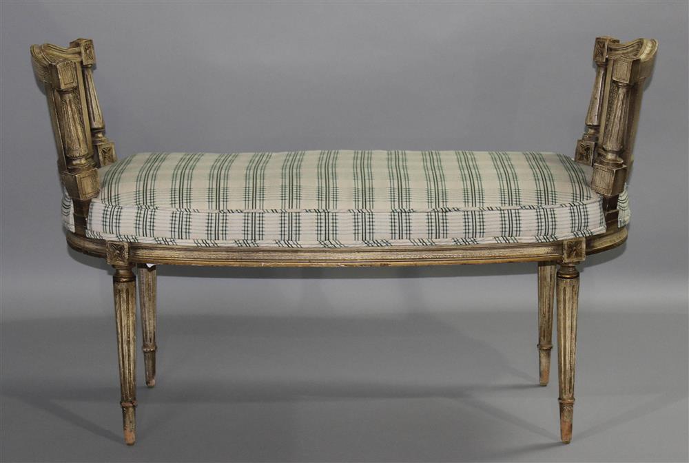 Appraisal: PETITE LOUIS XVI STYLE CREAM PAINTED AND CANED BANQUETTE the