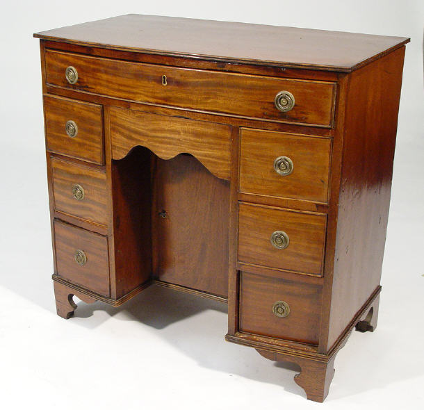 Appraisal: th Century bow fronted mahogany knee-hole chest fitted a long