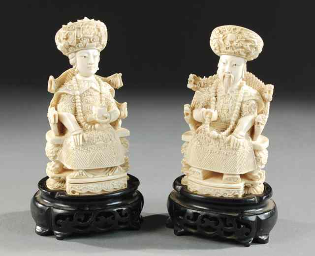 Appraisal: PAIR CARVED CHINESE IVORY FIGURES the emperor and empress each