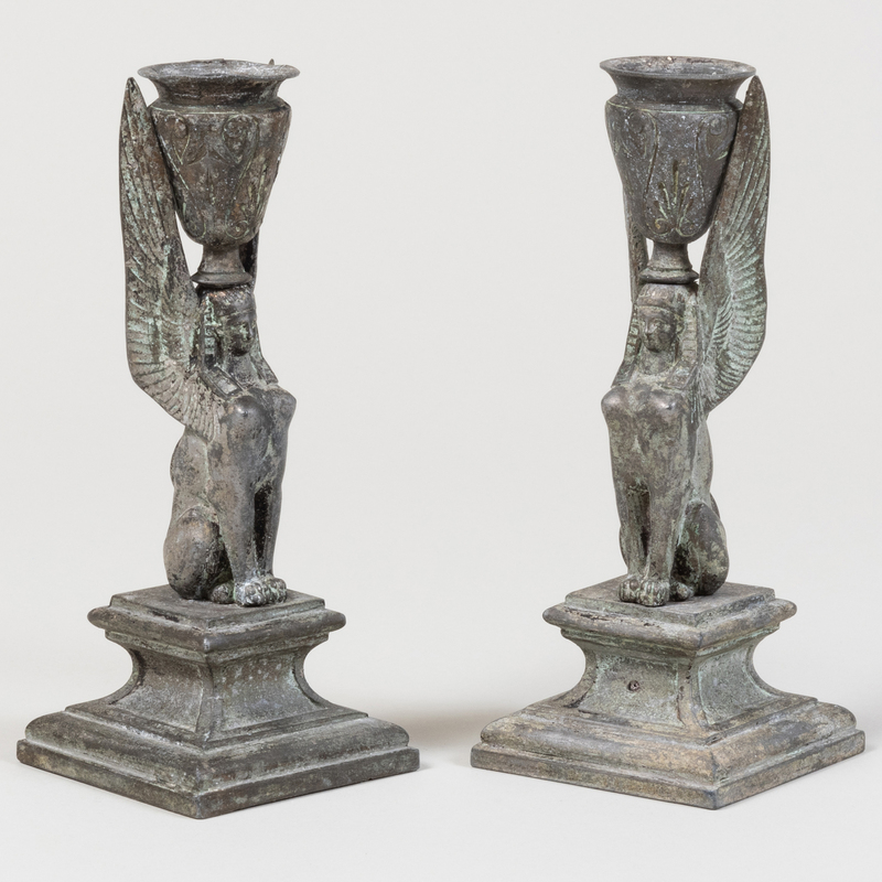 Appraisal: Pair of Patinated Metal Sphinx Form Candlesticks Unmarked x x