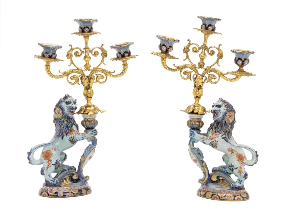 Appraisal: A pair of English glazed ceramic lion and gilt-bronze candlesticks