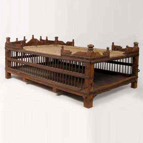 Appraisal: An Indian Wood and Iron Deity Rope Bed Swing early