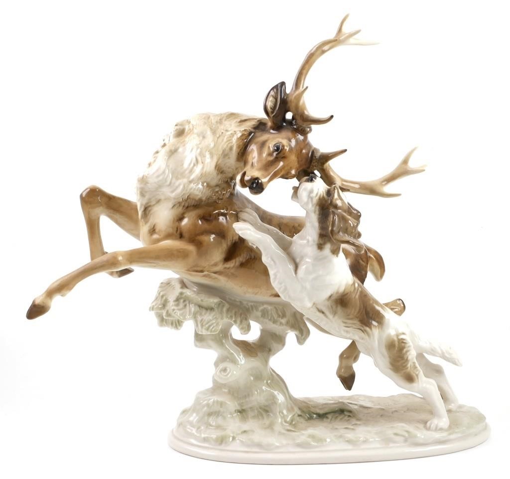 Appraisal: Porcelain figural group of a dog chasing a stag Designed