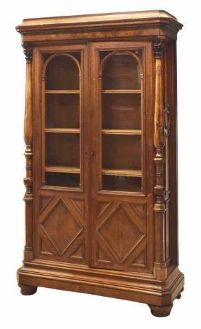 Appraisal: French transitional mixed-wood bookcase late thc having a concealed storage