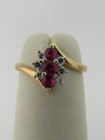 Appraisal: k yellow gold ruby and diamond mini cluster ring with