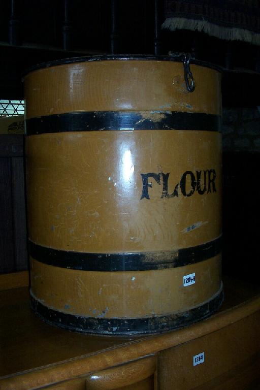 Appraisal: A Victorian tin flour bin of cylindrical form with simulated