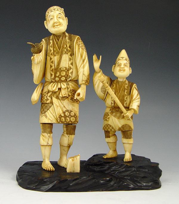 Appraisal: JAPANESE CARVED IVORY FATHER SON Scene features father with bird