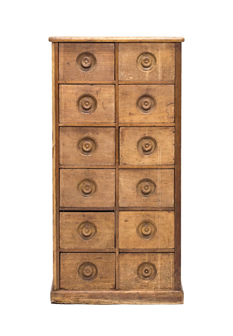 Appraisal: A th century pine and teak twelve drawer apothecary cabinet