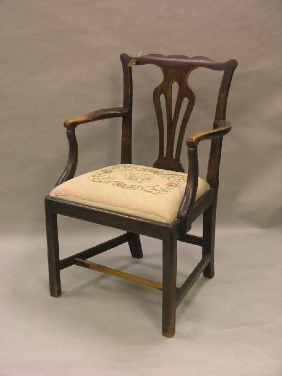 Appraisal: An th century Chippendale provincial elm armchair shaped top rail