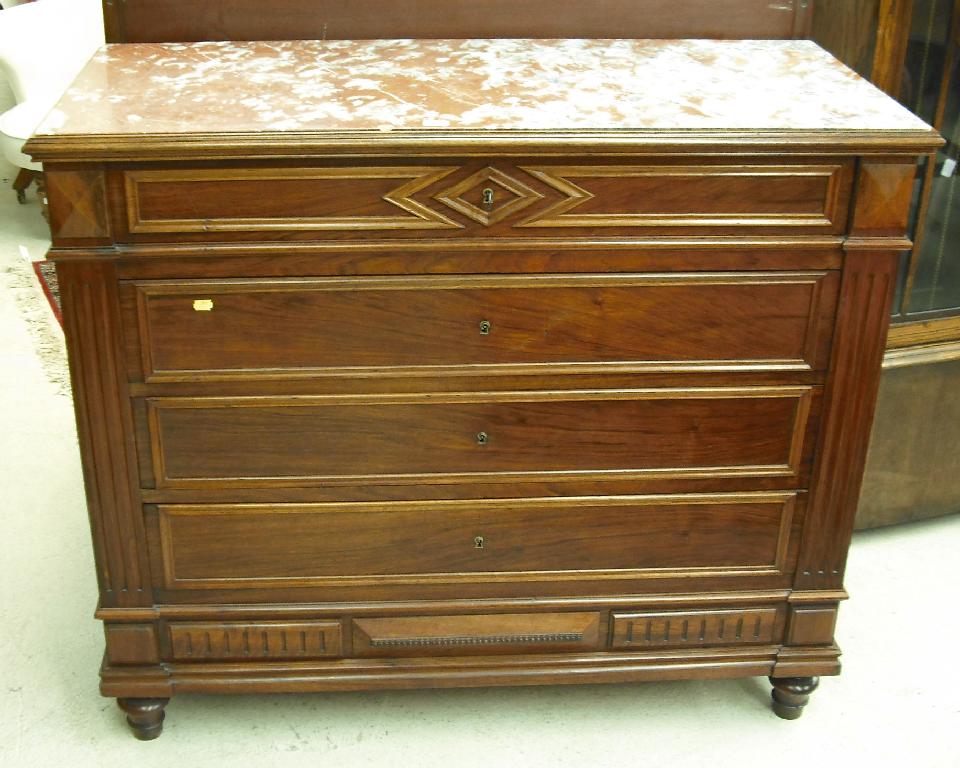 Appraisal: French walnut four drawer chest with a rouge marble top