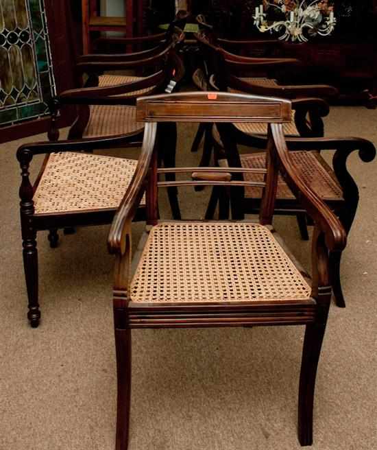 Appraisal: Group of seven Anglo-Indian style mahogany cane seat armchairs Estimate