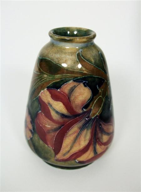 Appraisal: MOORCROFT MINIATURE TAPERING VASE CIRCA glazed earthenware tube line decoration