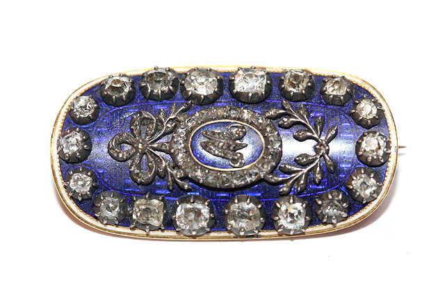 Appraisal: A GEORGIAN DIAMOND AND ENAMEL OVAL SHAPED BROOCH with diamond