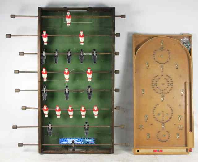 Appraisal: A wooden cased table-football pitch with cast painted players retailed