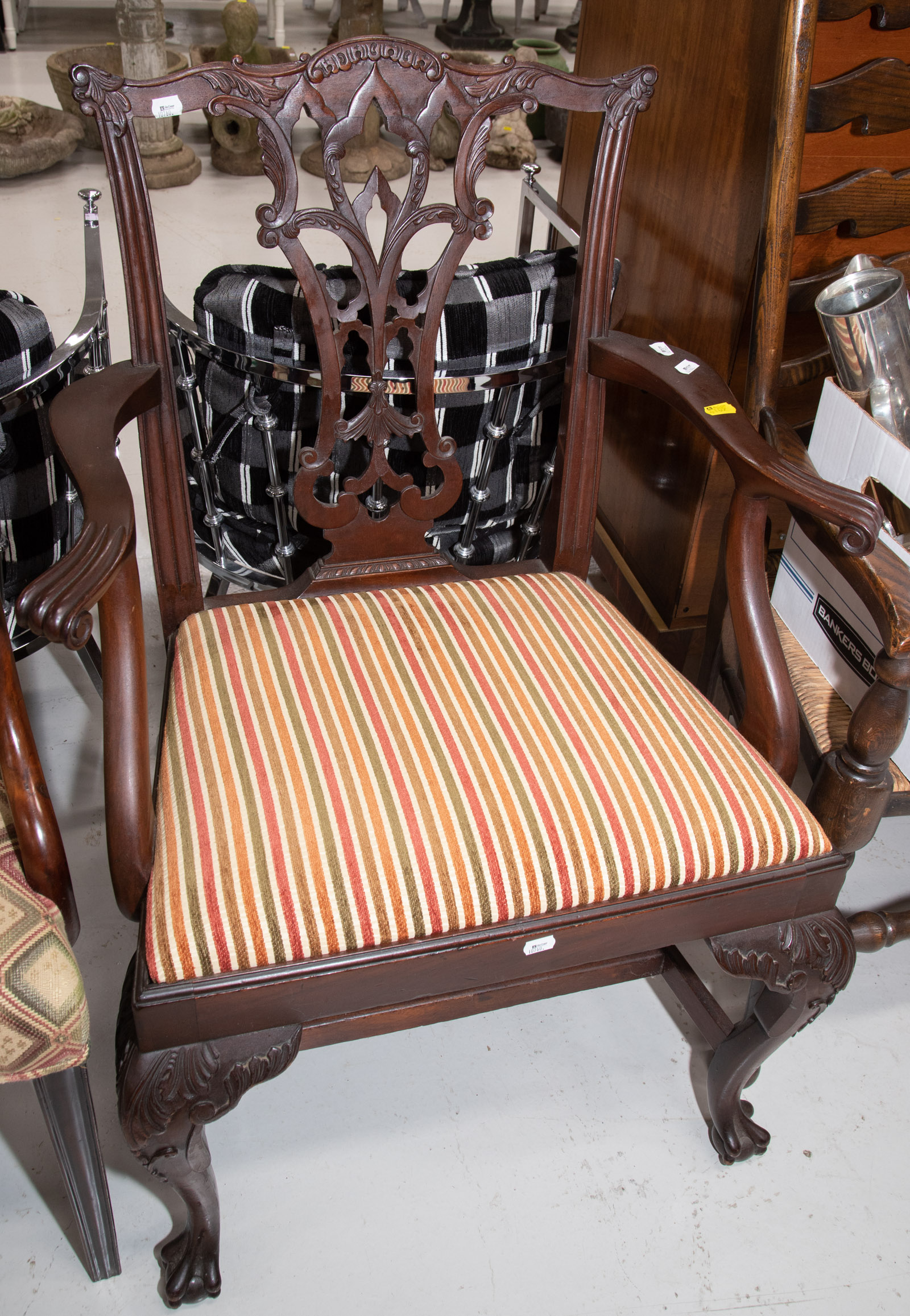 Appraisal: ORNATELY CARVED CHIPPENDALE STYLE ARM CHAIR Late th century