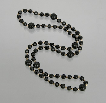 Appraisal: A Black Onyx Necklace Black onyx bead necklace with gold-filled