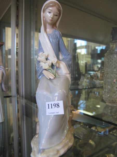 Appraisal: LLADRO FIGURE SEATED LADY WITH FLOWERS